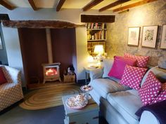 a living room filled with furniture and a fire place