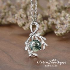 Moss Agate Leaf Pendant Necklace Women Olive Branch Necklace Nature Inspired Silver White Gold Chain Solitaire Cluster Necklace Dainty Gift ▶Pendant Details: ※Metal: 10K or 14K or 18K Solid Gold (Rose, White, or Yellow) , Silver ※Nature Moss Agate, Round Cut, 7mm ※Change Stones / Upgrade Stone Size, feel free to contact me! ※We can custom-make a Solid Gold Chain My Etsy shop: https://www.etsy.com/shop/oliviajewelryus ▶Tips: ※Accept return and exchange for normal orders. All returns are now eligible for a full refund! ※ Ring Size: All ring sizes are available, please contact me ※Material: As for material options - 14KW means 14k White Gold, and 14KY means Yellow Gold, 14KR means rose gold, YG Plated means Yellow Gold Plated, RG Plated means Rose Gold Plated, WG Plated means White Gold Plate Necklaces For Nature, Luxury Nature-inspired Silver Jewelry, Cheap Nature-inspired Silver Jewelry, Luxury Nature-inspired Necklace For Gift, Luxury Silver Nature-inspired Jewelry, Luxury Teardrop Nature-inspired Necklaces, Necklace Moss Agate, Nature Inspired Jewelry Agate, Luxury White Nature-inspired Necklaces