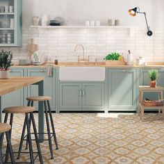 a kitchen with blue cabinets and counter tops