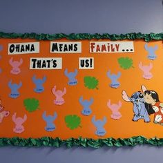 an orange bulletin board with cartoon characters on it