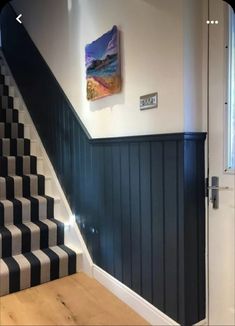 the stairs in this house are painted black and white