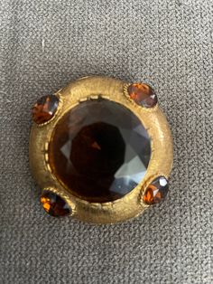 Dalsheim N.Y. circa 1960s brooch and pendant, in amber topaz stones. This is a beautiful statement piece that is a show stopper. We came across this piece at a Estate sale in Rumson, NJ.  This piece as all vintage jewelry has been previously loved by its original owner. Now you can add this to  We shop for vintage jewelry at Estate sales and rare glass beads and gemstones from all over the world including Czech Republic. We also repurpose vintage jewelry with added pieces of our rare gemstones. Vintage jewelry  Vintage and antique items are not mint nor are they perfect. Sold as is and as found (used and vintage) we do not clean the natural patina off but do a light cloth cleaning. These pieces have been previously loved by their original owners, now is your chance to extend the love to yo Original Robert Jewelry Vintage, Vintage Brown Brooch For Collectors, Men's Brooch, Luxury Vintage Gemstone Brooches, Vintage Multicolor Multi-stone Brooch, Dragon Ring, Topaz Color, Vintage Gold Multi-stone Brooches, Rare Gemstones