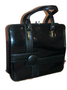 Vintage Mod black patent purse with leather trim and button. *12 inches wide   *10 1/2 inches tall *clean interior Vintage Black Shoulder Bag With Snap Closure, Vintage Black Shoulder Bag For Office, Elegant Black Satchel With Snap Closure, Retro Black Satchel For Office, Retro Black Office Satchel, Black Retro Evening Satchel, Retro Black Shoulder Bag For Business, Black Retro Shoulder Bag For Business, 60s Mod