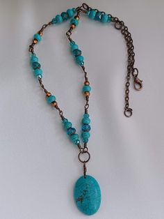 This is a hand wire-wrapped necklace that will accent your formal or casual attire.  It is a simple necklace but will definitely add a touch of elegance.  This necklace has semiprecious beads, Czech glass and crystals. It has a beautiful Howlite oval bead in turquoise color as pendant.  I hand wire-wrapped each bead segment with 22 gauge wire in vintage bronze tone.  This necklace is 18 inches long and I finished it with a stainless steel lobster claw clasp. Featured beads: - Gemstone, Howlite, 25x17mm dyed turquoise oval bead - Gemstone, Wagnerite, 6x4mm smooth rondelle beads - Czech glass, 6mm cathedral style beads - Crystal, 4x3mm faceted rondelle beads, blue zircon and metallic bronze   Metal: - Chain, steel with antique copper finish - Stainless steel findings This is a handmade piece Artisan Turquoise Hand Wrapped Necklaces, Turquoise Wire Wrapped Necklace For Beach, Artisan Hand Wrapped Turquoise Necklaces, Artisan Hand Wrapped Turquoise Necklace, Adjustable Wire Wrapped Turquoise Necklace Gift, Adjustable Wire Wrapped Turquoise Necklace With Round Beads, Artisan Turquoise Wire Wrapped Necklaces, Adjustable Turquoise Wire Wrapped Necklace, Turquoise Hand Wrapped Round Bead Necklaces