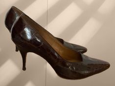 "These gorgeous shoes by designer Frank Moore appear to be from the 1960s. Constructed of alligator with leather insoles.  Incredibly classy.  There is no size on the shoes. They are a narrow fit  Measures: length: 10\" - width: 3\" - heel height: 3 1/2\"  Vintage condition: excellent!" Fitted Leather Heels With Crocodile Pattern, Brown Crocodile Pattern Pointed Toe Dress Shoes, Vintage Brown High Heel Heels, Vintage Brown Leather High Heels, Vintage Brown Evening Heels, Air Force Uniforms, Vintage Brown Heeled Boots, Medium Width, Blue Milk, Womens Pumps