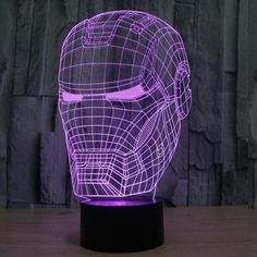 a 3d image of a helmet is shown on a table with the light turned on