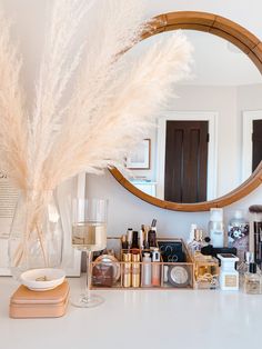 a mirror sitting on top of a white counter