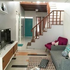 a living room filled with furniture and a flat screen tv