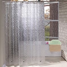 the shower curtain is open and ready to be used in the bathroom, with water droplets on it