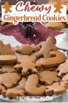 some gingerbread cookies are on a plate and in the background is snowflakes