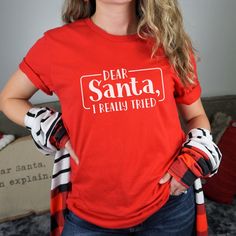 This Funny Christmas short Sleeve tee fits like a well-loved favorite. A great gift for anyone who has a quirky sense of humor or even yourself. Ideal for any situation, a unisex jersey made of soft cotton with a ribbed knit collar will retain its shape even after washing. The shoulders are tapered for a better fit, no itchy seams and has a tear-away label to minimize skin irritation. Easy to layer, breathable, perfect for active and leisure wear. All T-shirts are made to order. They will ship w Fun Red T-shirt With Letter Print, Funny Holiday T-shirt With Graphic Print, Fun Red T-shirt, Funny Print T-shirt For Christmas Gift, Graphic Tee Crew Neck T-shirt As Gift, Funny Red Pre-shrunk Tops, Funny Red Tops With Letter Print, Red Fun T-shirt With Funny Print, Fun Red T-shirt With Funny Print