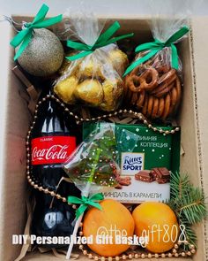 an open box filled with assorted christmas treats and snacks, including pretzels