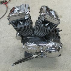 the motorcycle engine is parked on the concrete