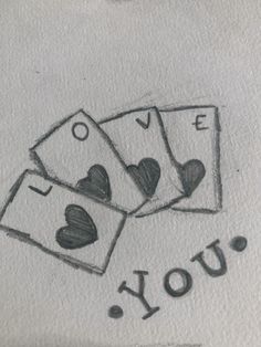 four playing cards with the words i love you written in black ink on white paper