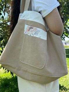 "Hello and thank you so much for supporting our new shop.✨ All items are handmade in our family atelier. Our canvas tote bags feature a minimalist, chic and comfortable design. This one has a wide pocket on the inside of the bag for easy access to your most valuable items, and a wide pocket on the outer side for your water bottle. This handmade cotton tote bag is lined with cotton on the inside, and made with wide straps to make it more comfortable on the shoulders when packed. When filled with heavy items, our totes will not \"dig in\" to your shoulders or hurt them, due to the wide straps.  Thanks for stopping by and happy shopping!" Chic Canvas Bag With Pockets For Everyday, Chic Everyday Canvas Bag With Pockets, Chic Canvas Shoulder Bag With Pockets, Everyday Hobo Tote Bag With Pockets, Beige Tote Shoulder Bag With Flat Pocket, Everyday Beige Canvas Bag With Flat Pocket, Everyday Beige Bag With Flat Pocket, Everyday Beige Bags With Flat Pocket, Beige Canvas Bag With Pockets For Everyday Use