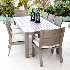 an outdoor table and chairs on a patio