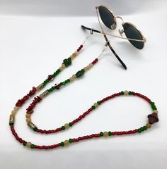 Whether you're headed to a festival, taking a stroll along the beach, or just walking around the block, these sunglass chains are both handy and stylish to bring along for the ride. Convenient if you want to let your glasses hang comfortably on your chest, or put them on to add some flair to any activity you're getting into. Elastic endpieces stretch out and make it easy to slide the chain onto any pair of sunglasses or reading glasses. Each pair is handmade with love in colorful Colorado :) Custom designs are welcome, let me know what you have in mind and I'd love to make it happen! **Photos 3 & 4 are just examples of what they look like on, not necessarily the exact same pair you're looking at. Bohemian Sunglasses With Gradient Lenses For Summer, Bohemian Summer Sunglasses With Gradient Lenses, Bohemian Sunglasses With Uv Protection For Vacation, Adjustable Sunglasses For Summer Travel, Trendy Beaded Glasses Chains For Festivals, Trendy Green Glasses Chains For Beach, Trendy Summer Glass Jewelry, Trendy Adjustable Sunglasses For Travel, Trendy Glass Festival Jewelry