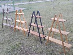 several wooden shelves sitting in the grass