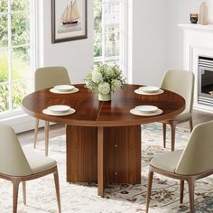 a dining room table with chairs around it and a fire place in the corner behind it