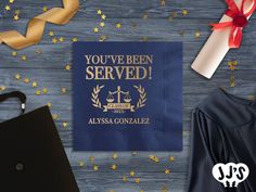 you've been served blue beverage napkins with gold stars and ribbon on top