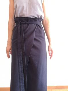 Invisible zip on the back. With small fringes details on the bottom. Size Small. Measurements Front waist is 40 cm Lenght is 80 cm Cotton Belted Skirt, Cotton Belted Relaxed Skirt, Chic Cotton Skirt With Tie Waist, Belted Long Wrap Skirt, Fitted Cotton Skirt With Belt, Asymmetrical Cotton Wrap Skirt For Workwear, Cotton Wrap Skirt For Work, Long Cotton Skirt With Tie Waist, Belted Long Relaxed Skirt