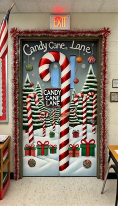 a candy cane door decorated with christmas decorations