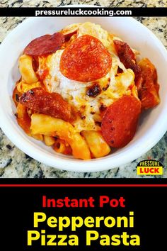 a white bowl filled with pasta and pepperoni