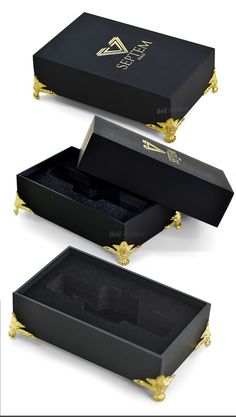 three black boxes with gold trims and handles on each side, one is empty