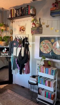 there are many books and other items on the shelves in this room, including plates