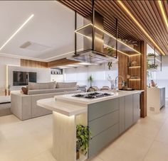 a modern kitchen and living room are featured in this image, with an island countertop