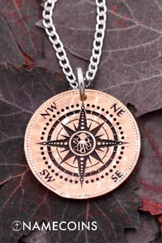 a necklace with a compass on it