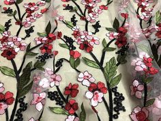 red and pink flowers on white sheer fabric