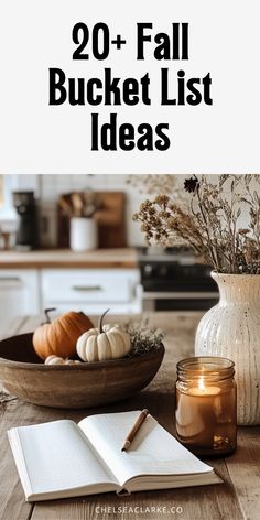 a wooden table topped with an open book next to a bowl filled with pumpkins