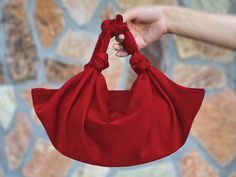 "🔘 This Elegant Satin Knot bag is ideal for the wedding day, night out, party, special occasion, brides, bridesmaids, mothers of the bride, or any formal fun. 🔘 This bag has a snap closure and inside it has a stable zipper pouch which has a long pocket for a smartphone. You can put an iPhone Plus into the bag and also some other essentials in it. is perfect for a night-out bag - comfortably fits my iPhone 14 Plus, lipstick, and a coin purse.   🔘 Dimensions of the inside zippered pouch: L17 cm Elegant Red Shoulder Bag Gift, Red Handheld Evening Bag As Gift, Red Handheld Evening Bag For Gifts, Handheld Red Evening Bag As Gift, Red Evening Bag Suitable As Gift, Red Evening Gift Bag, Red Gift Bag For Evening, Red Shoulder Evening Bag As Gift, Chic Red Evening Bag For Gift