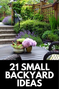 a small backyard with flowers on the table and steps leading up to an outdoor deck