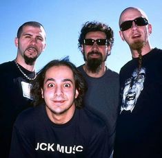 three men standing next to each other in front of a blue sky with the words jck music on it