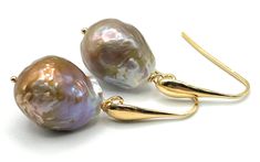 "A pair of stunning big flameball pearl earrings with flashy accents and drop shaped hooks. All findings are in Italian Gold Vermeil 24 K. These earrings are 100% Made in Italy Would make a great gift for June birthdays or for bridesmaids. SIZE: LENGTH:  1.6 inches - 4 cm  WEIGTH:  6 gr.  Pearls: 17 x 14  mm MATERIALS: Gold Vermeil 24 K - Made in Italy Freshwater pearls: Pearl signifies faith, charity and innocence. It enhances personal integrity and helps to provide a focus to ones attention. P High Luster Teardrop Pearl Earrings, Baroque Pearl Teardrop Earrings For Party, Baroque Pearl Teardrop Earrings With High Luster, Teardrop Baroque Pearl Earrings For Party, Teardrop Pearl Earrings With French Hook, High Luster Baroque Pearl Teardrop Earrings, Personal Integrity, Earrings Big, Baroque Pearl Earrings