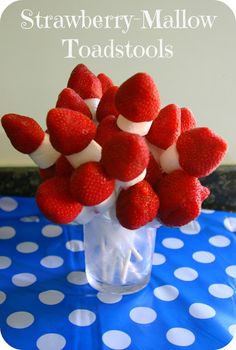 strawberries in a glass vase with marshmallows on top