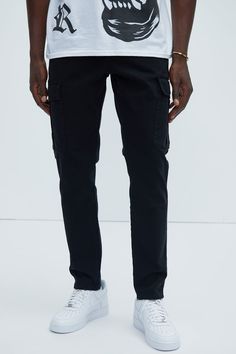 Available In Black, Khaki Button Closure Zip Fly Side Pockets Back Pockets Cargo Pockets Slim Fit 98% Cotton 2% Spandex Imported | Mens Kyle Slim Cargo Pants in Black size 36 by Fashion Nova Black Tapered Leg Jeans With Cargo Pockets, Casual Elastane Chinos With Pockets, Casual Chinos With Pockets, Tapered Leg Elastane Jeans With Pockets, Tapered Leg Jeans With Pockets, Casual Elastane Pants With Belt Loops, Black Pants With Side Pockets In Elastane, Elastane Work Pants With Pockets, Black Athleisure Pants With Side Pockets