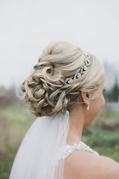 a woman with blonde hair wearing a tiara