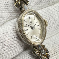 Omega Jeweled Ladies Cocktail watch 10k Gold Filled Case 17 Jewels Wind Up movement made in Switzerland by Omega keeping good time. Beautiful cocktail watch. Ships immediately Vintage White Gold Watches With Subdials, Vintage Diamond Watch With Subdials For Anniversary, Antique White Gold Watch With Polished Finish, Collectible Timeless White Gold Watches, Antique White Gold Watches With Polished Finish, Timeless White Gold Collectible Watches, Antique White Gold Collectible Watch, Vintage White Gold Watches With Polished Finish, Vintage White Gold Watches With Round Dial