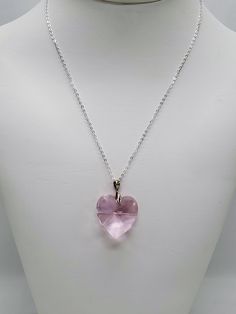 Elegant Swarovski rose heart pendant necklace.  Rose is the color of the October birth month.  Necklace is sterling silver chain, approximately 18 inches, with spring clasp closure.  Crystal heart pendant is 28mm.  This necklace is great for everyday wear.  It could also be a nice gift for someone. Bail style varies Pair this necklace with rose heart earrings: https://www.etsy.com/listing/820390626/ OR pair this necklace with rose butterfly and Pearls: https://www.etsy.com/listing/820386486/ See Pink Heart Pendant, Pink Pendant Necklace, Pink Heart Necklace, Rose Butterfly, Valentine Gift For Wife, Cultured Pearl Bracelet, Swarovski Pendant, Crystal Heart Necklace, Swarovski Crystal Hearts