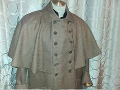 Fitted Cape For Costume And Winter, Fitted Cape For Winter Costumes, Fitted Cape For Costume, Winter Season, Fitted Cape For Costume Occasions In Winter, Winter Costume Double-breasted Outerwear, Victorian Style Long Winter Coat, Victorian Style Costume Outerwear For Fall, Victorian Costume Outerwear For Fall, Victorian Long Coat For Fall