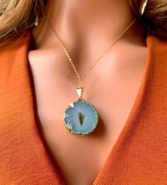 Unique 24k gold-edged teal geode pendant featuring a shimmering crystallized quartz center. 14k Gold-filled Chain Pendant: 1 1/4" x 1 1/4" 11" Long Turquoise Gemstone Crystal Pendant Necklace, Luxury Unique Turquoise Pendant Necklace, Luxury Agate Necklace With Large Pendant, Geode Pendant Necklace, Geode Necklace, Electroformed Agate Pendant Necklace, Gold Filled Chain, Chain Pendants, Gold Filled