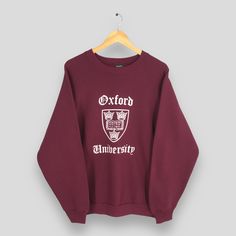 Vintage 90s Oxford University Red Sweatshirt Large Oxford University Printed Logo Pullover Oxford Cambridge Sweater Oxford Crewneck Size L Size On Tag :- Size L Manual Measurement :- WIDTH (armpit to armpit) :- 23.5" inches LENGTH (shoulder to end of garment) :- 27.5" inches WEIGH :- 0.42 kg Condition :- Good Condition. No holes and no stains. - Colors Might Be Different Due To Lighting. - All items are VINTAGE which show some signs of wear and tear. FEDEX EXPRESS = 3-6 business day arrived Plea Oxford Sweatshirt, Oxford University Autumn, University Red Pre-shrunk Collegiate T-shirt, Oxford University Sweatshirt, Stanford University Sweatshirt, Campus Style, University Sweatshirts, Oxford University, Print Logo