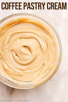 a bowl filled with coffee pastry cream on top of a table