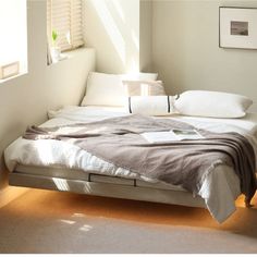 the bed is made up and ready for someone to use it in their home or office