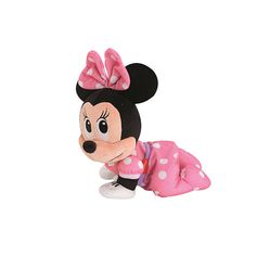 a minnie mouse stuffed animal laying on top of a white surface with pink polka dots