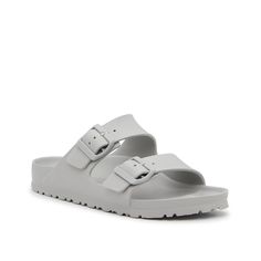 Birkenstock-Arizona Essentials EVA Slide Sandal - Women's The women's Arizona Essentials sandal is right on trend and fits into your warm weather wardrobe thanks to their casual silhouette. These vibrant slides from Birkenstock feature a flexible EVA material and a waterproof finish for easy care. Comfortable Gray Sandals For Summer, Gray Flat Sandals For Spring, Gray Flat Sandals For The Beach, Gray Sandals For Summer Vacation, Gray Sandals For Spring Outdoor, Summer Gray Sandals With Cushioned Footbed, Gray Slip-on Sandals For Vacation, Gray Slides For Summer Beach, Gray Slides For Beach In Summer