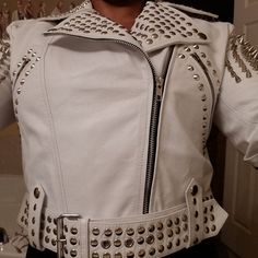 Handmade White Studded Leather Jacket Women Customized Made to Order Women's Silver Studded Genuine Leather Jacket (279) Studded Jacket made with 100 % Genuine Top Quality Cowhide Leather Silver Studded High Quality Studs. Each securely added by hand Cropped, Vintage - Inspired Motorcycle / Moto / Biker Fit 0.9 to 1.0 MM Cowhide Leather used Soft Real Leather All sizes Available Make sure to Look at the size chart below before selecting your size. There can be slight difference between the origi Studded Fitted Biker Jacket With Long Sleeves, Fitted Studded Long Sleeve Biker Jacket, Fitted Long Sleeve Biker Jacket With Studs, Fitted Long Sleeve Studded Biker Jacket, Fitted Studded Winter Outerwear, Winter Fitted Studded Outerwear, Fitted Winter Outerwear With Studs, Fitted Studs Outerwear For Streetwear, Studded Long Sleeve Winter Outerwear